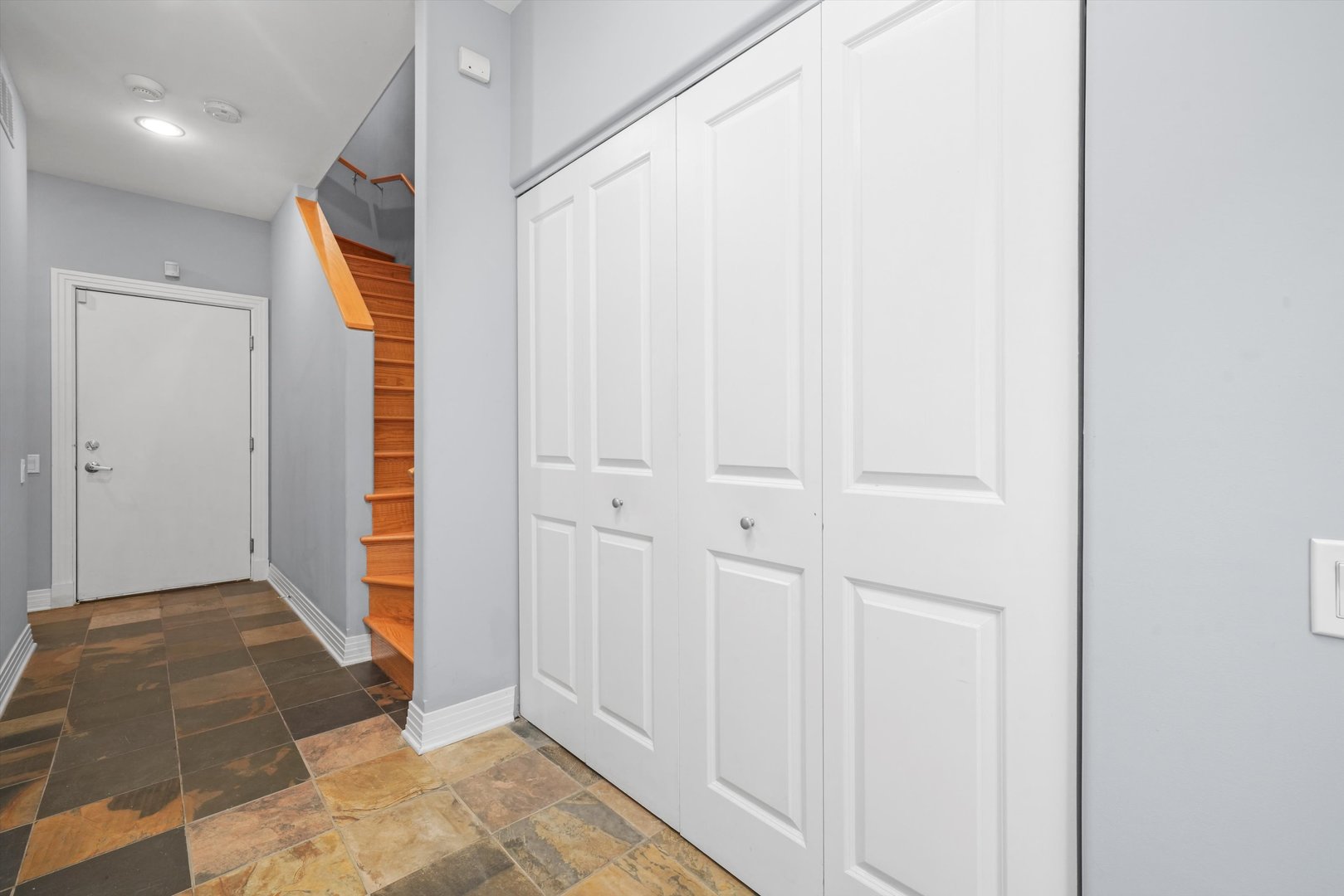1055 West Monroe Street, Unit A Chicago, IL 60607 - Photo 24 of 28 a view of a hallway with wooden floor and closet
