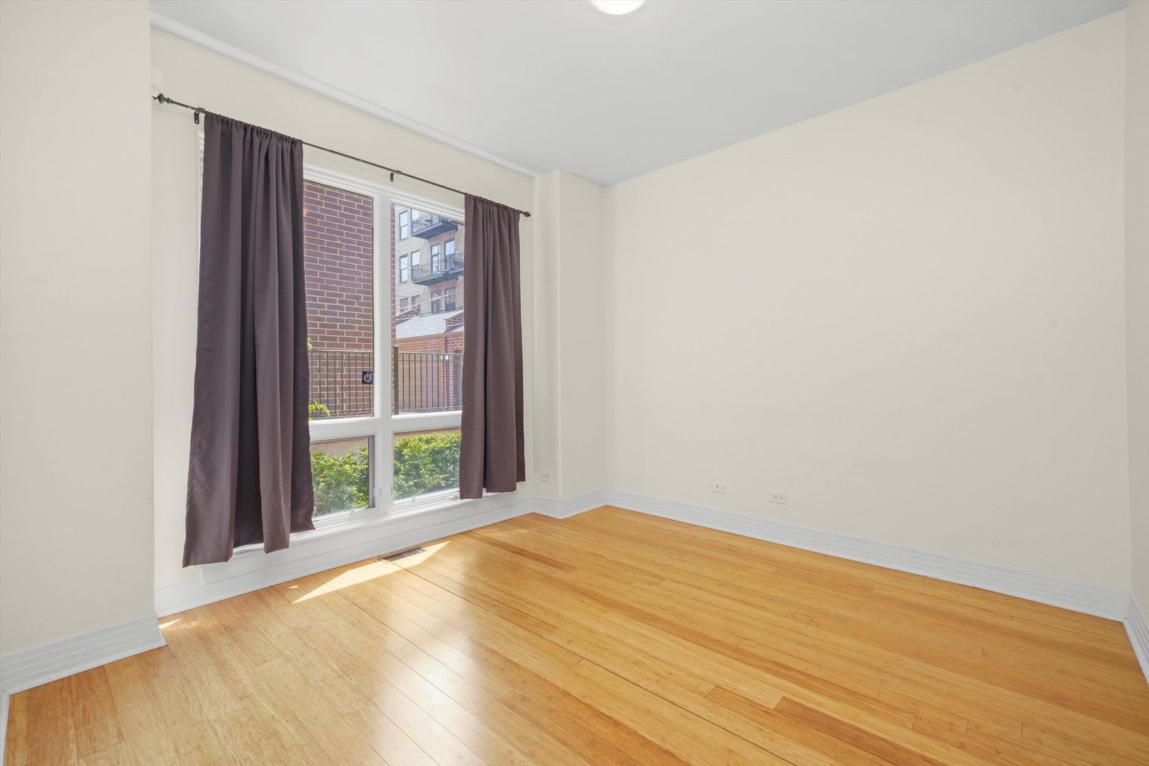 1055 West Monroe Street, Unit A Chicago, IL 60607 - Photo 25 of 28 a view of an empty room with a window