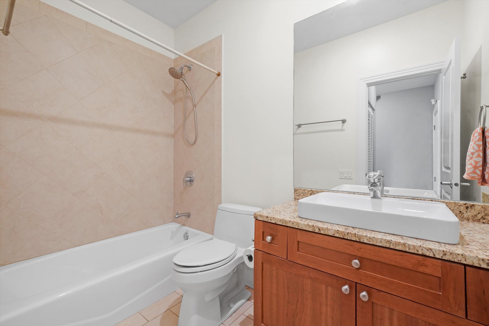 1055 West Monroe Street, Unit A Chicago, IL 60607 - Photo 26 of 28 a bathroom with a granite countertop sink toilet and shower