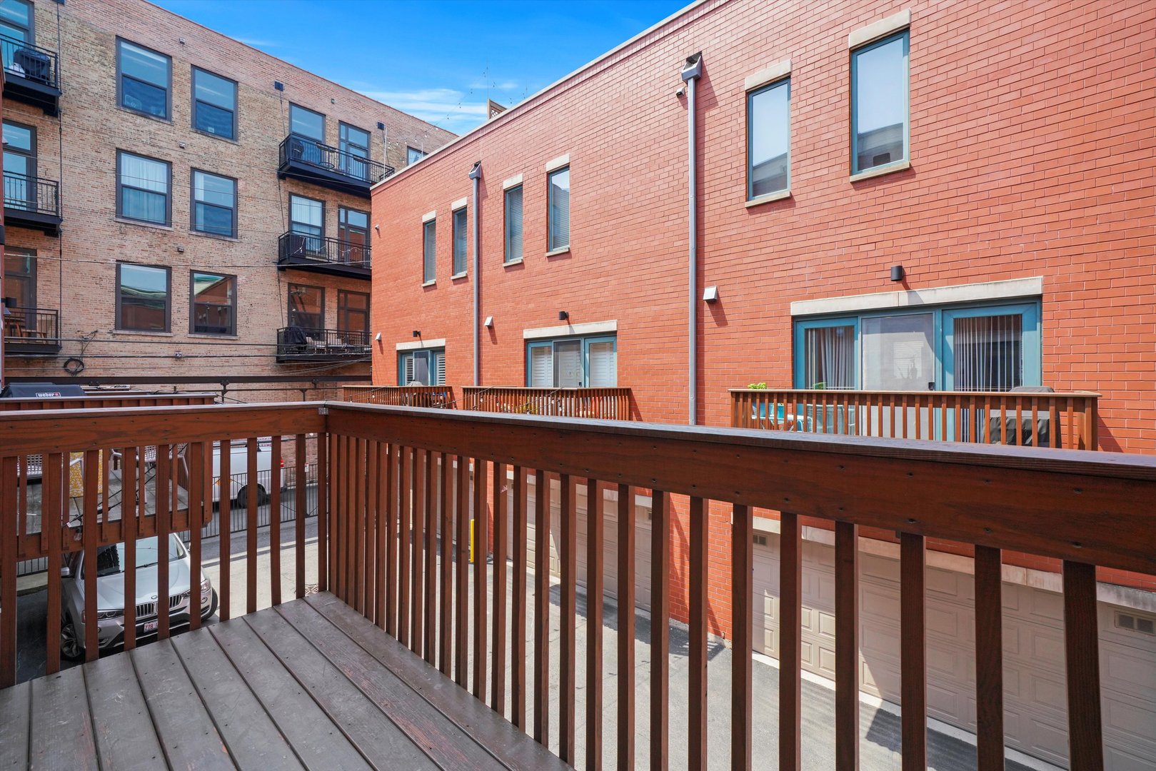 1055 West Monroe Street, Unit A Chicago, IL 60607 - Photo 7 of 28 a view of a brick building from a balcony