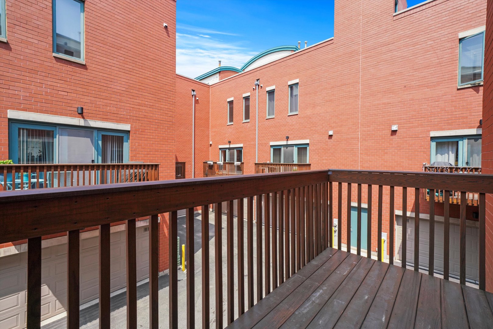 1055 West Monroe Street, Unit A Chicago, IL 60607 - Photo 8 of 28 a view of a brick building from a balcony
