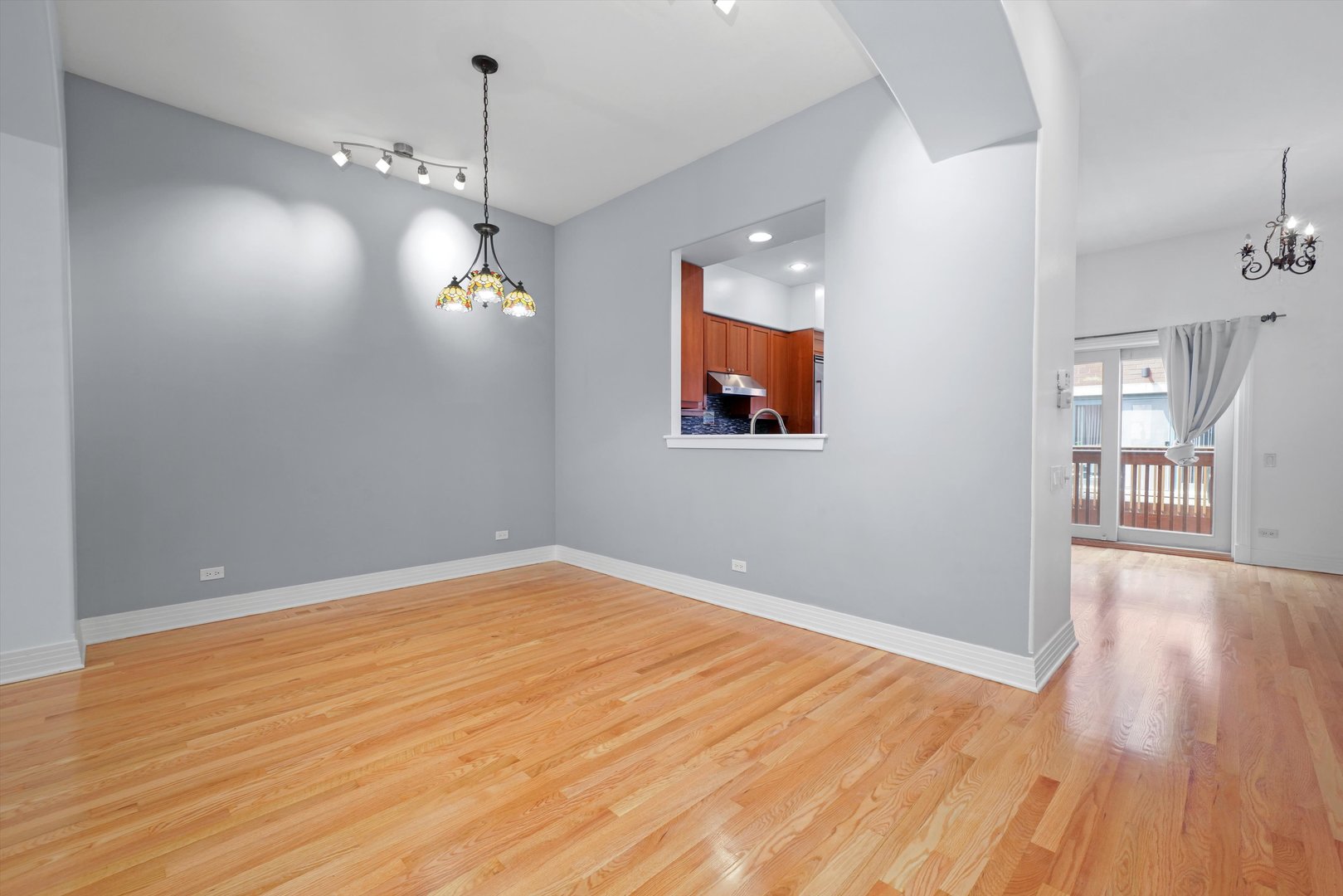 1055 West Monroe Street, Unit A Chicago, IL 60607 - Photo 9 of 28 wooden floor in an empty room with a window