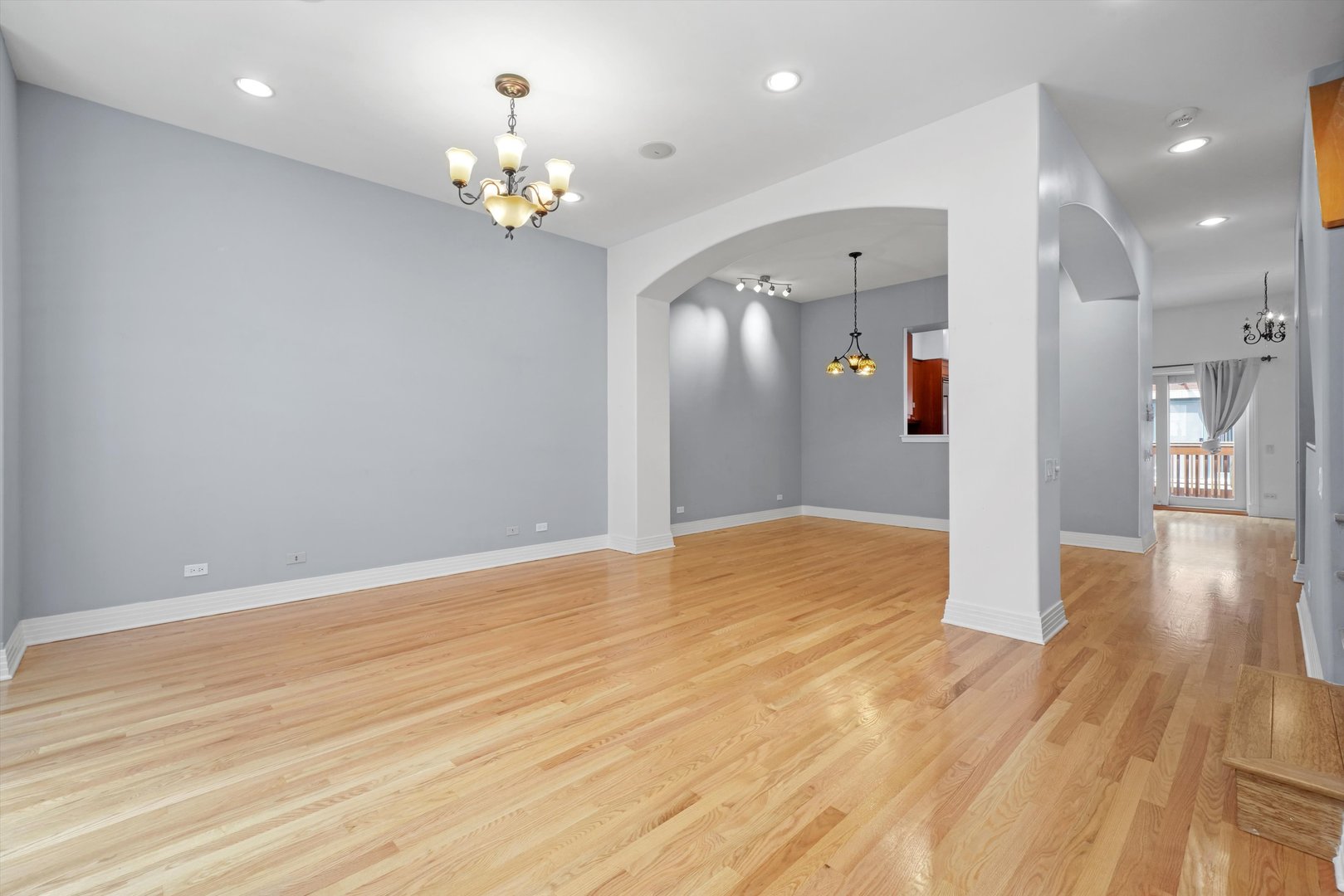 1055 West Monroe Street, Unit A Chicago, IL 60607 - Photo 10 of 28 a view of livingroom with kitchen and chandelier