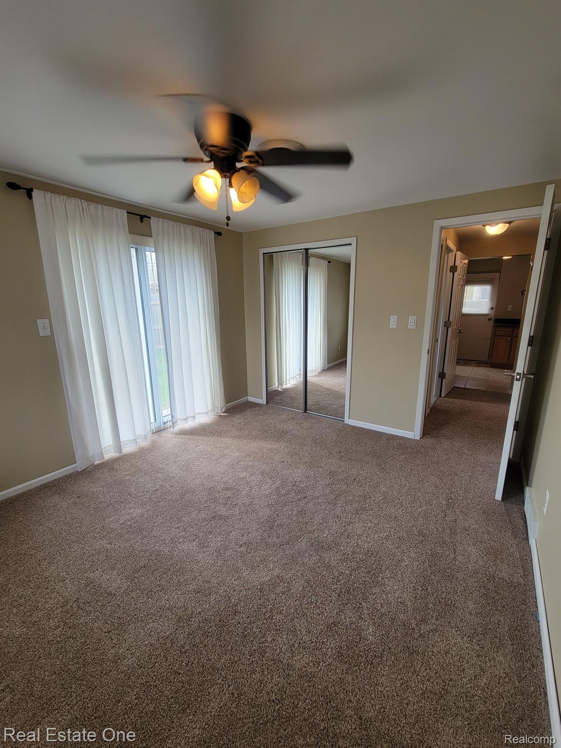 308 North Rochester Road, Unit 1 Clawson, MI 48017 - Photo 17 of 22 Primary Bedroom, closet and sliding door