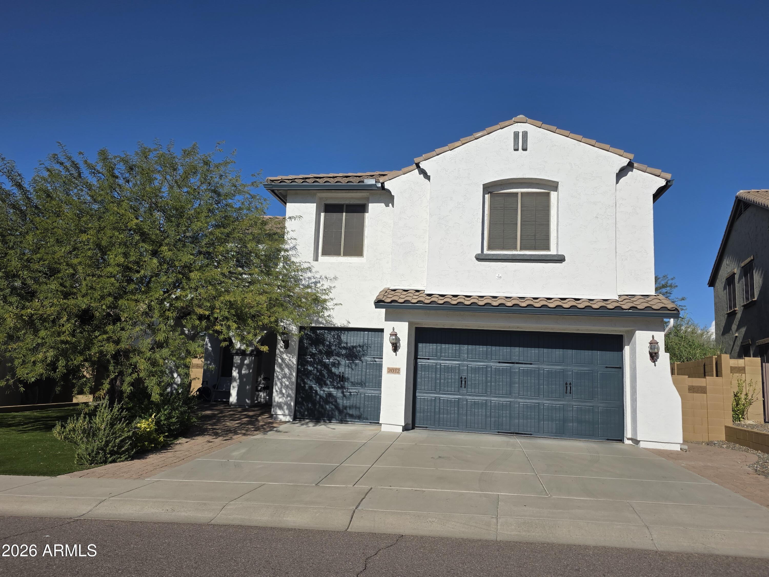 2012 West Chimney Rock Road Phoenix, AZ 85085 - Photo 2 of 61 a front view of a house with a garage