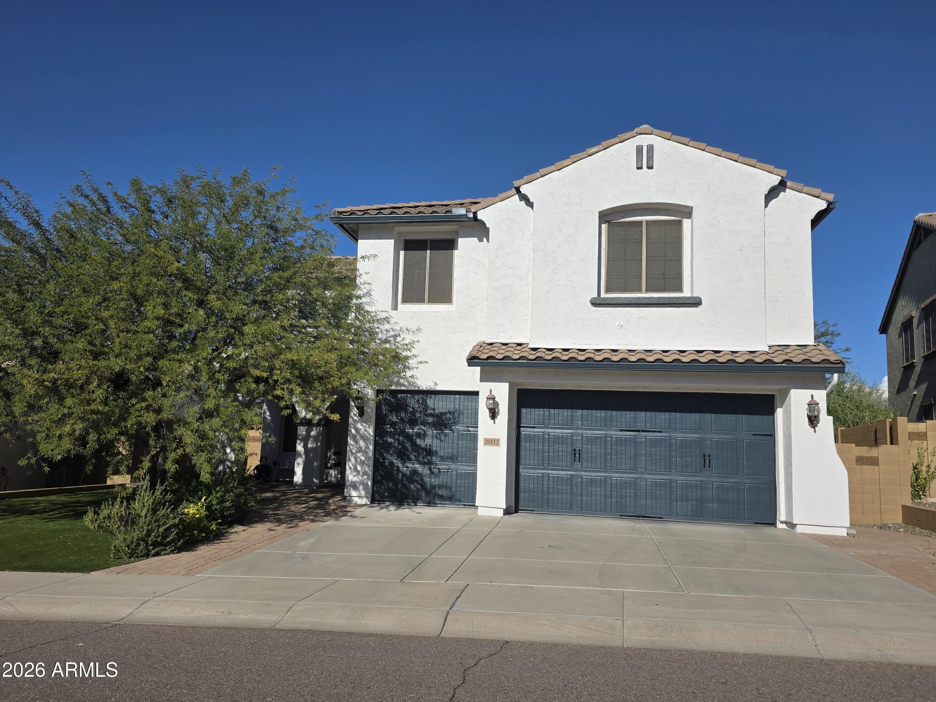 2012 West Chimney Rock Road Phoenix, AZ 85085 - Photo 3 of 61 a front view of a house with a garage