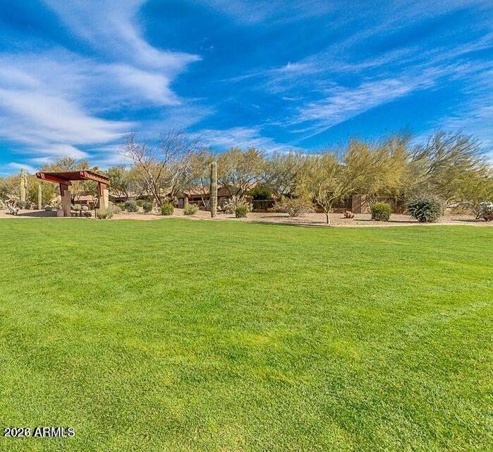 2012 West Chimney Rock Road Phoenix, AZ 85085 - Photo 45 of 61 a view of a big yard with a building in the background