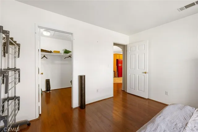 a view of a room with wooden floor and bathroom