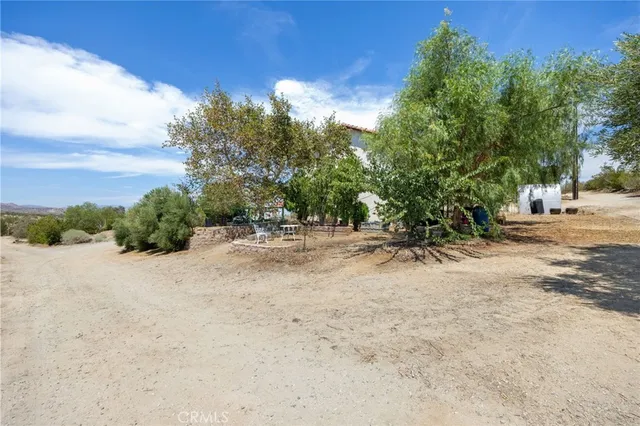 a view of a backyard of a house