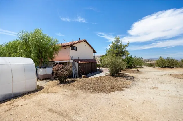 a view of a backyard of a house