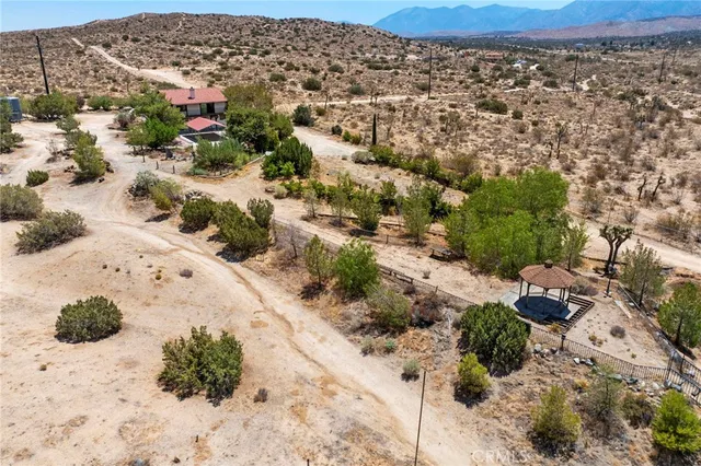 a view of a pathway with a yard