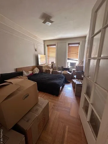 a living room with a couch and a window