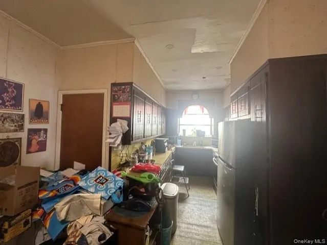 a bedroom with furniture a bed and a chandelier