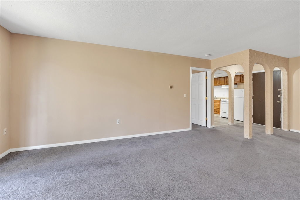 23 Shadowbrook Lane, Unit 6 Milford, MA 01757 - Photo 3 of 11 a view of an empty room