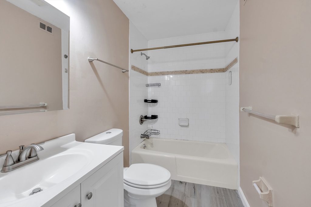 23 Shadowbrook Lane, Unit 6 Milford, MA 01757 - Photo 6 of 11 a bathroom with a sink toilet and shower