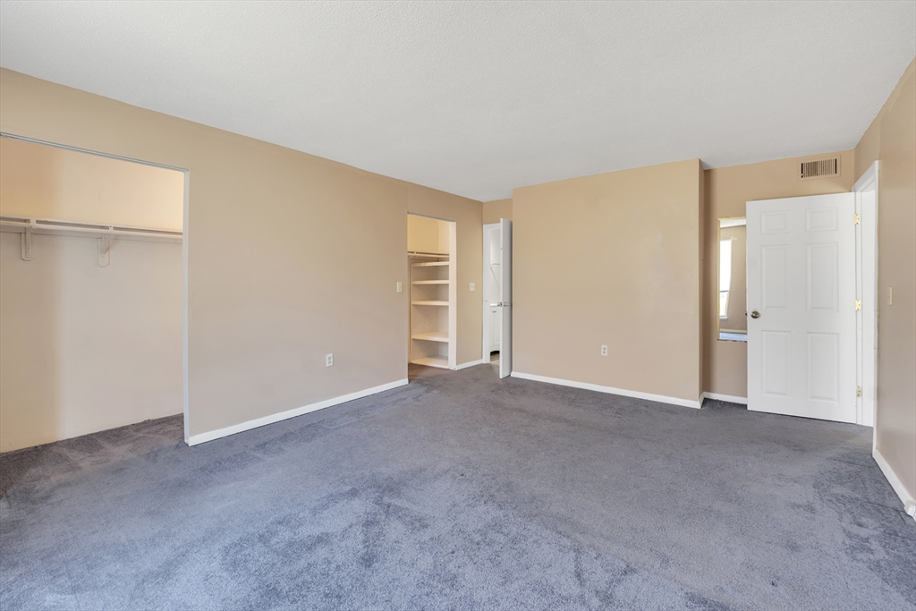 23 Shadowbrook Lane, Unit 6 Milford, MA 01757 - Photo 7 of 11 a view of an empty room with a window