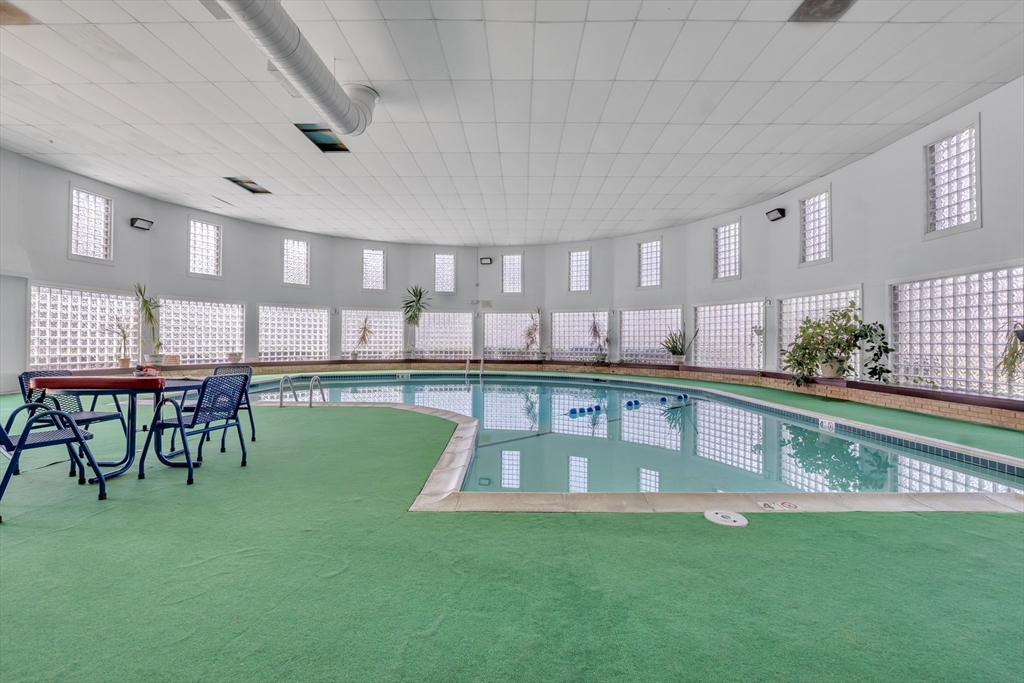 23 Shadowbrook Lane, Unit 6 Milford, MA 01757 - Photo 9 of 11 a view of kitchen with a table and chairs
