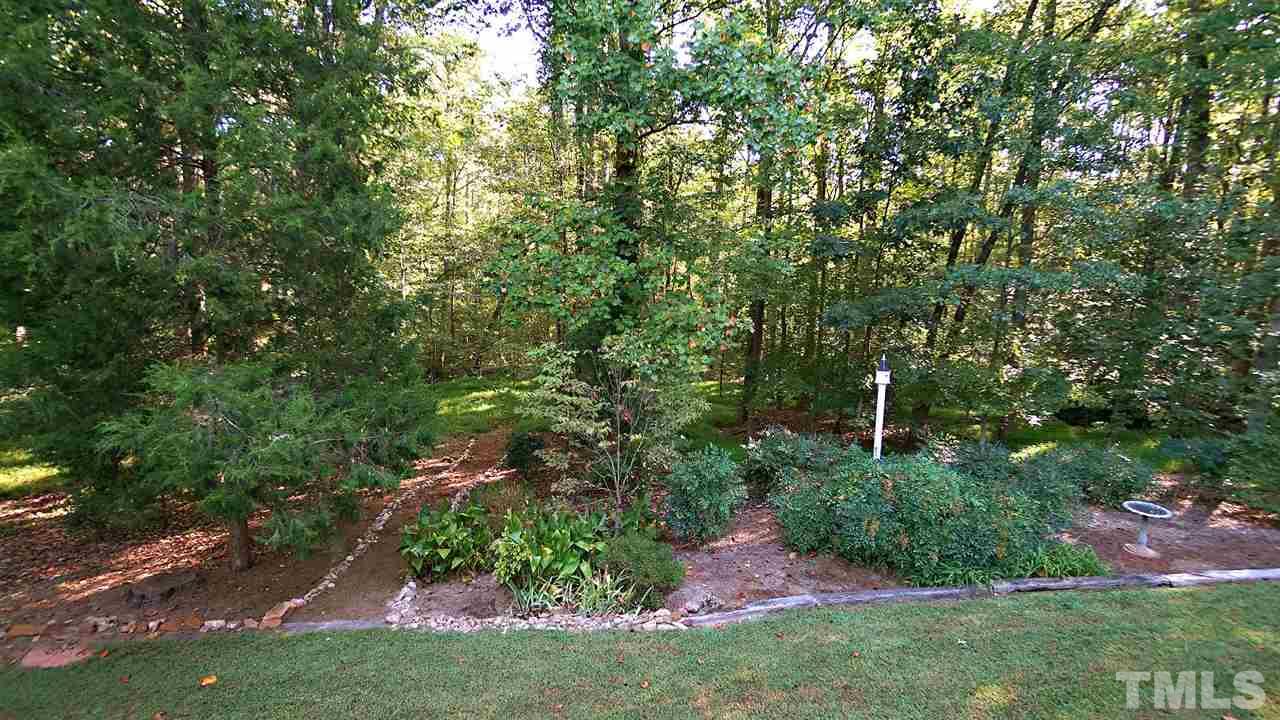 5113 Forest Creek Road Raleigh, NC 27606 - Photo 2 of 30 Tranquil back yard, enjoy the quiet peacefulness of 3 private acres, wild life and more