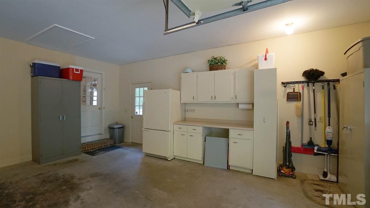 5113 Forest Creek Road Raleigh, NC 27606 - Photo 21 of 30 Main level 2 car garage w/ built ins