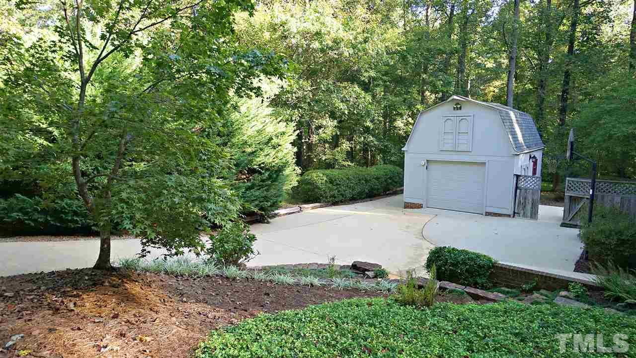 5113 Forest Creek Road Raleigh, NC 27606 - Photo 24 of 30 4th car garage or detached workshop-storage area above. Private parking pad off to the side