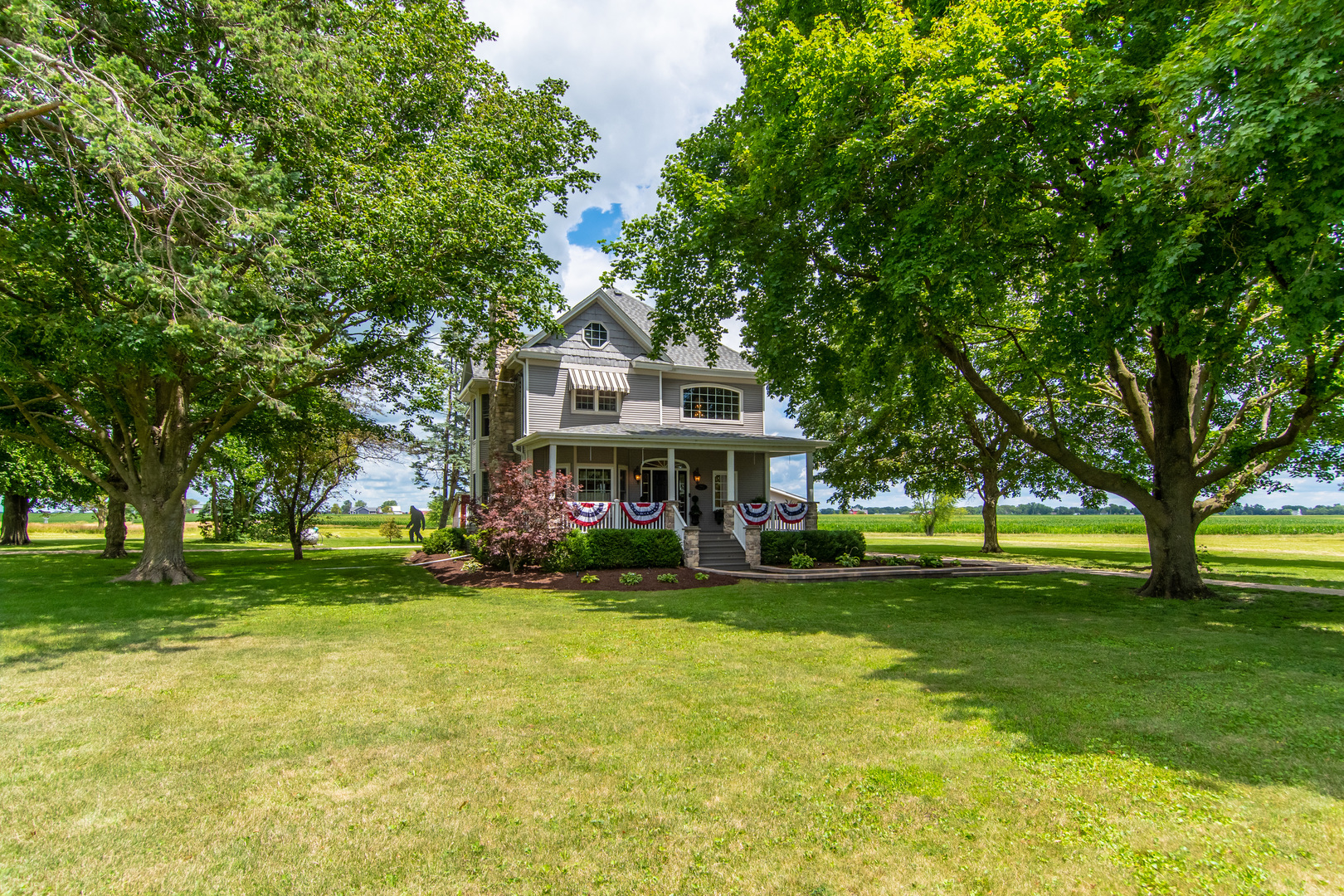 7961 Chicago Road Minooka, IL 60447 - Photo 16 of 63 a front view of a house with garden and trees