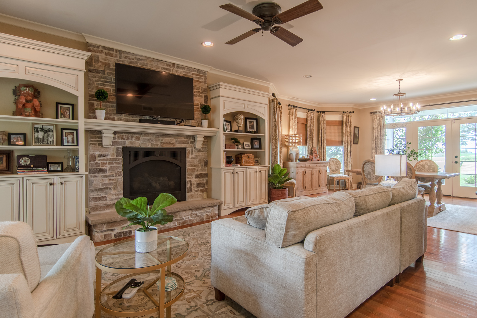 7961 Chicago Road Minooka, IL 60447 - Photo 29 of 63 a living room with furniture a flat screen tv and a fireplace