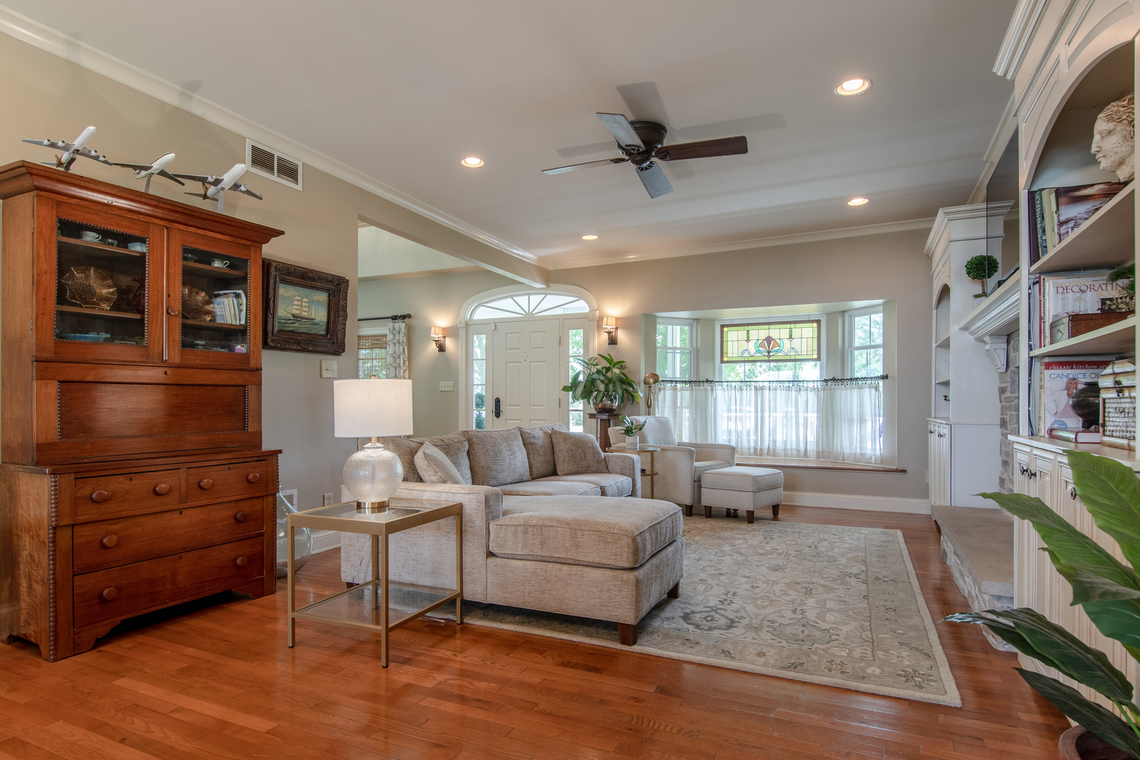 7961 Chicago Road Minooka, IL 60447 - Photo 31 of 63 a living room with furniture and a flat screen tv