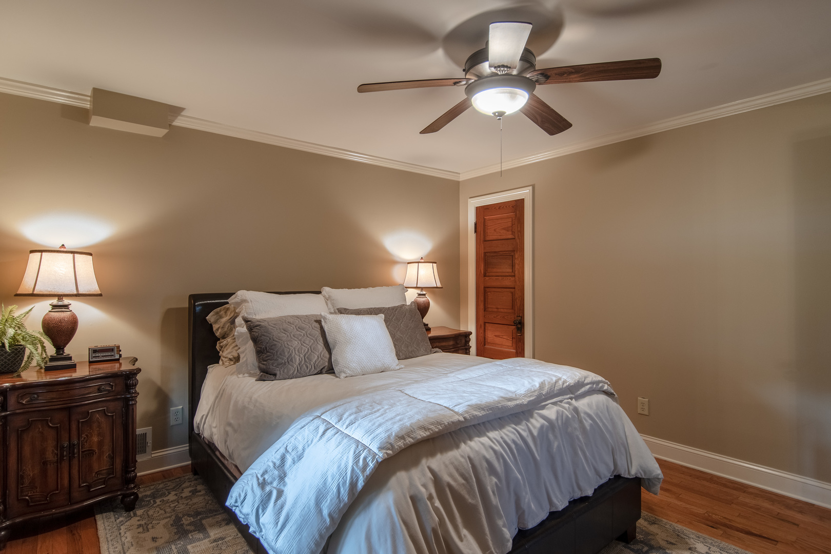 7961 Chicago Road Minooka, IL 60447 - Photo 57 of 63 a bedroom with a bed and a chandelier