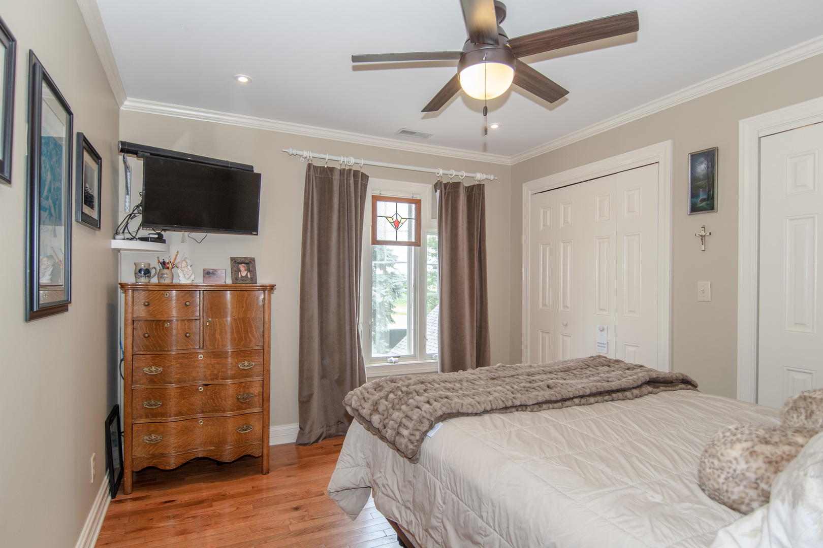 7961 Chicago Road Minooka, IL 60447 - Photo 59 of 63 a bedroom with a bed and a flat screen tv