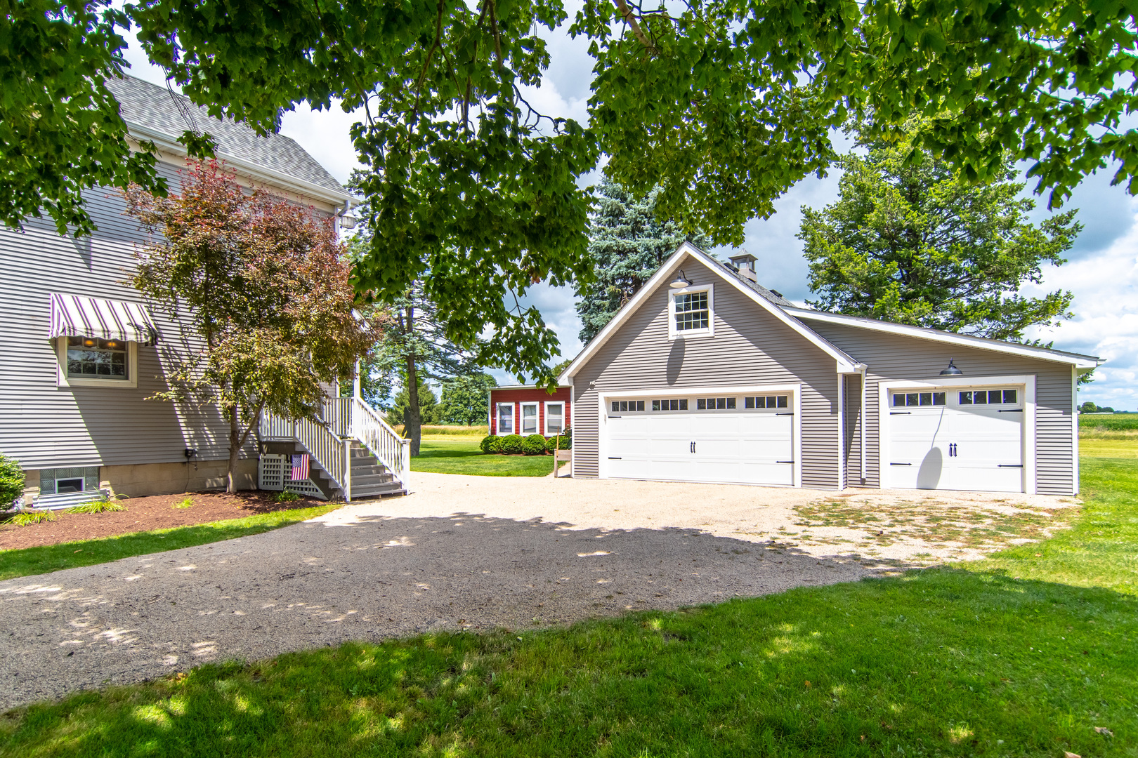 7961 Chicago Road Minooka, IL 60447 - Photo 9 of 63 a view of a house with a yard and large tree