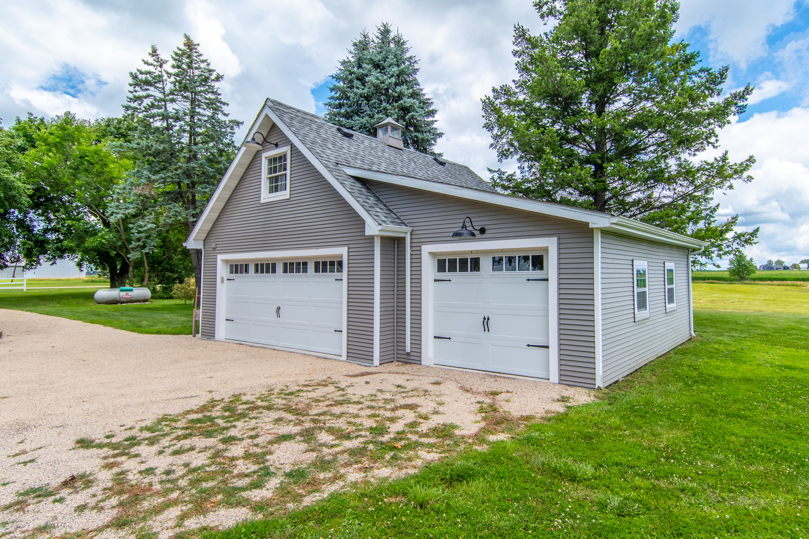 7961 Chicago Road Minooka, IL 60447 - Photo 10 of 63 a view of a house with a yard and garage