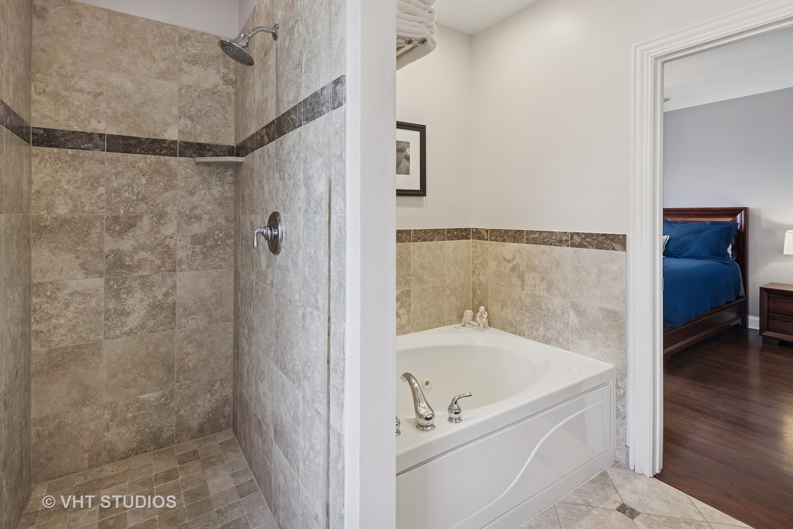 1608 West Grace Street Chicago, IL 60613 - Photo 15 of 25 a bathroom with a bathtub and a shower