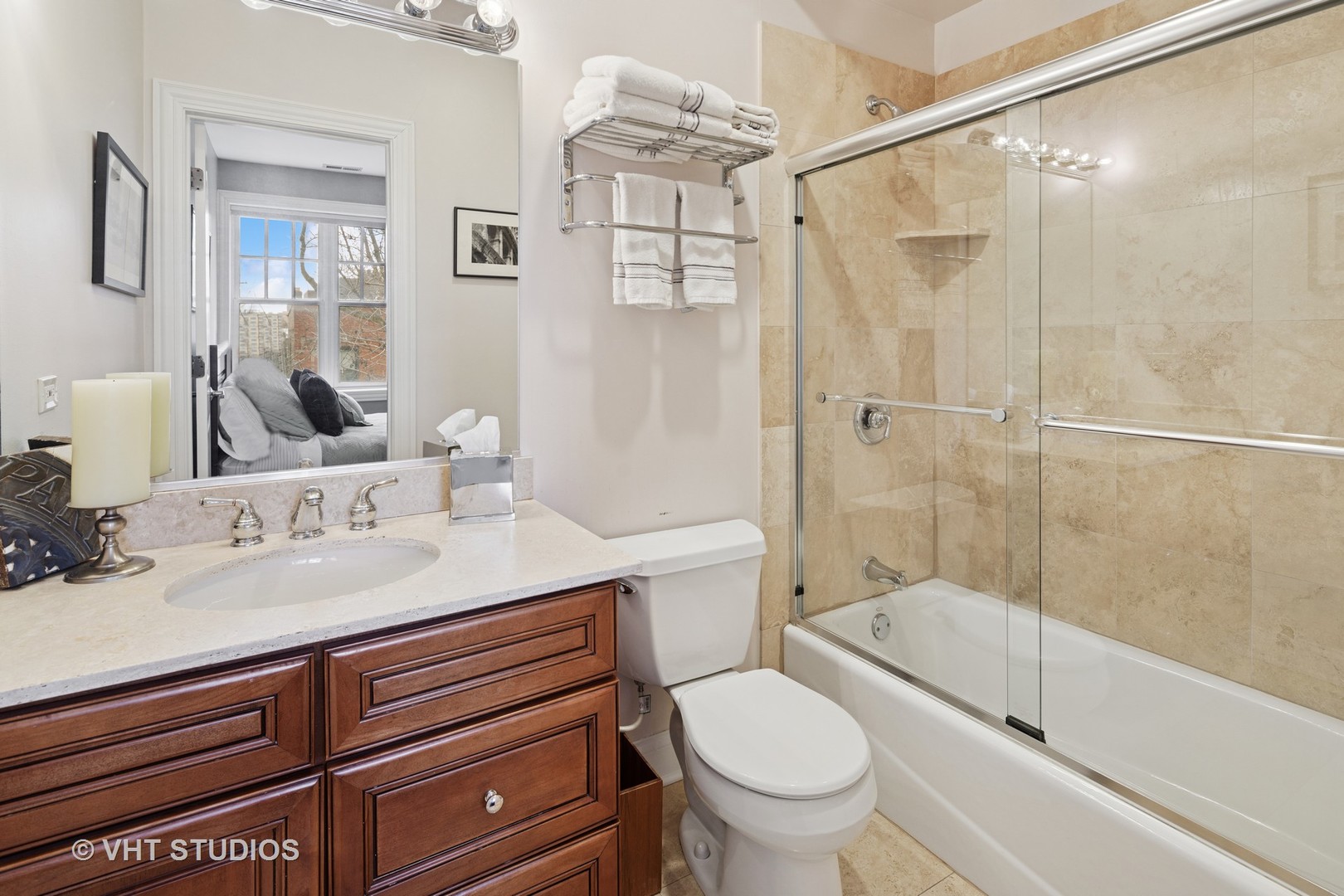 1608 West Grace Street Chicago, IL 60613 - Photo 19 of 25 a bathroom with a sink a toilet and shower