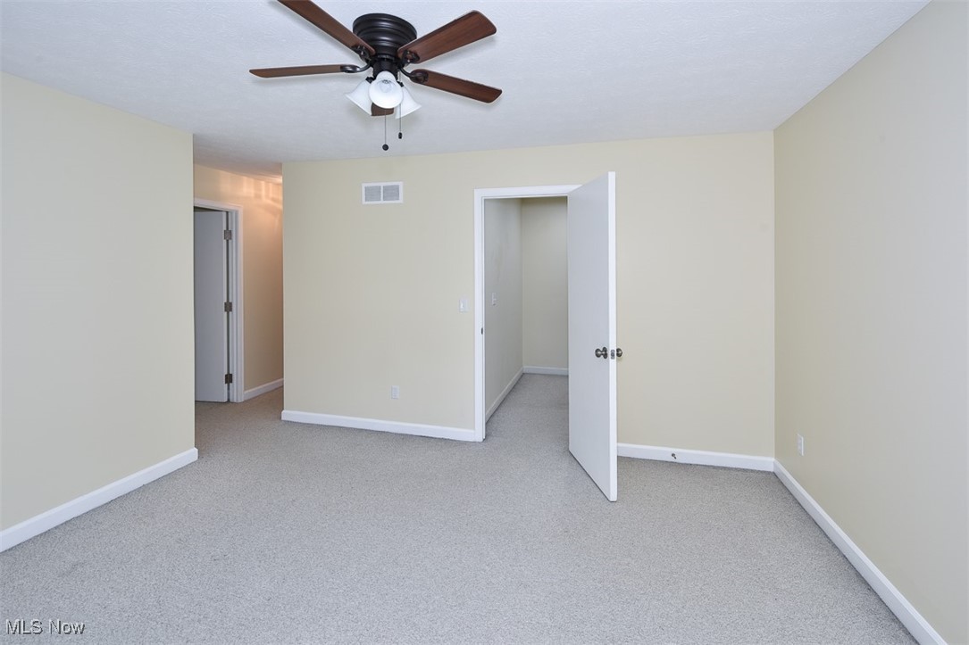 30776 Cedar Road Cleveland, OH 44124 - Photo 26 of 41 Empty room with light carpet and a ceiling fan