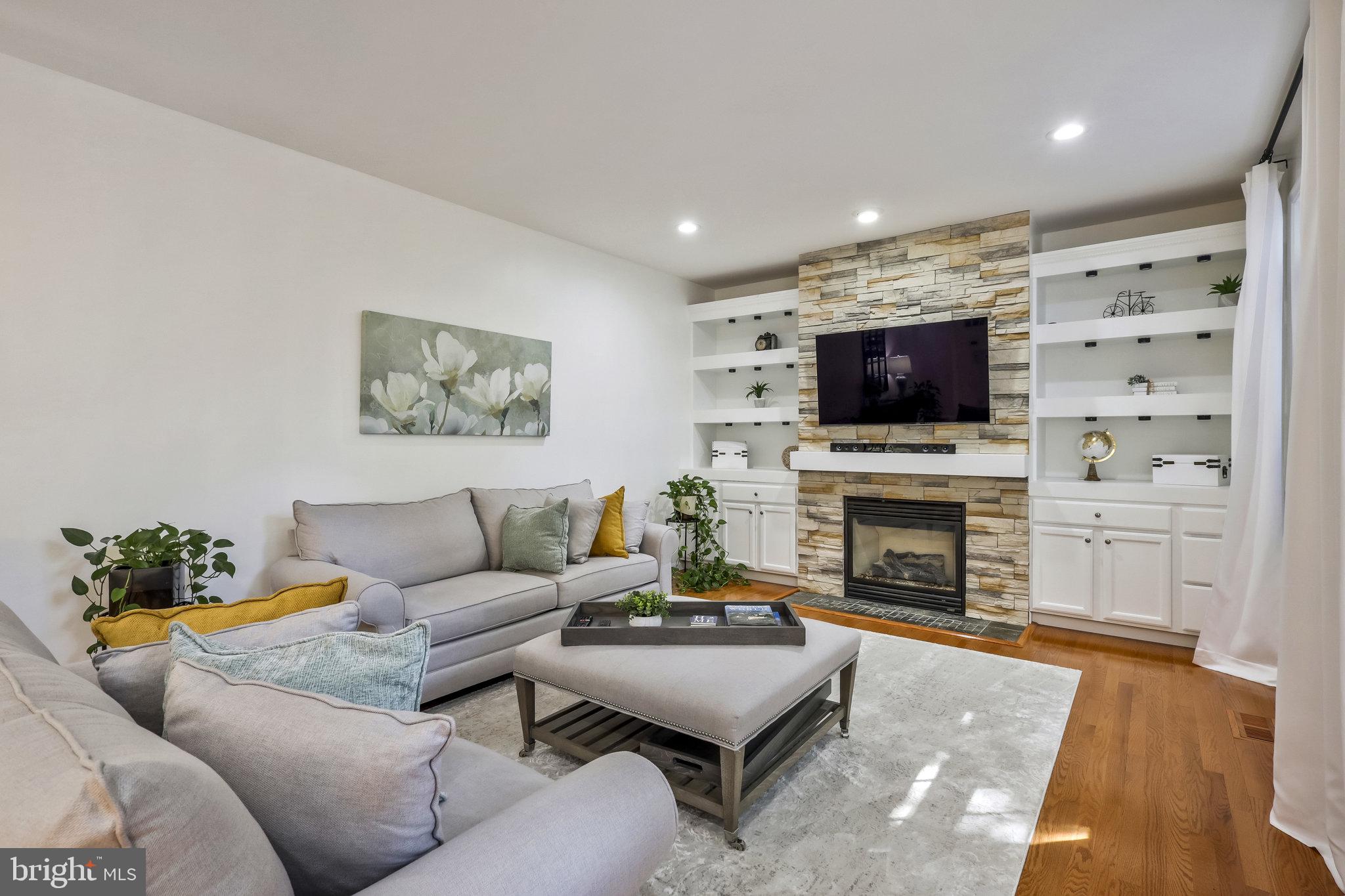 7715 Ridgepark Court Springfield, VA 22153 - Photo 24 of 69 Gas Fireplace and Built-in Shelves