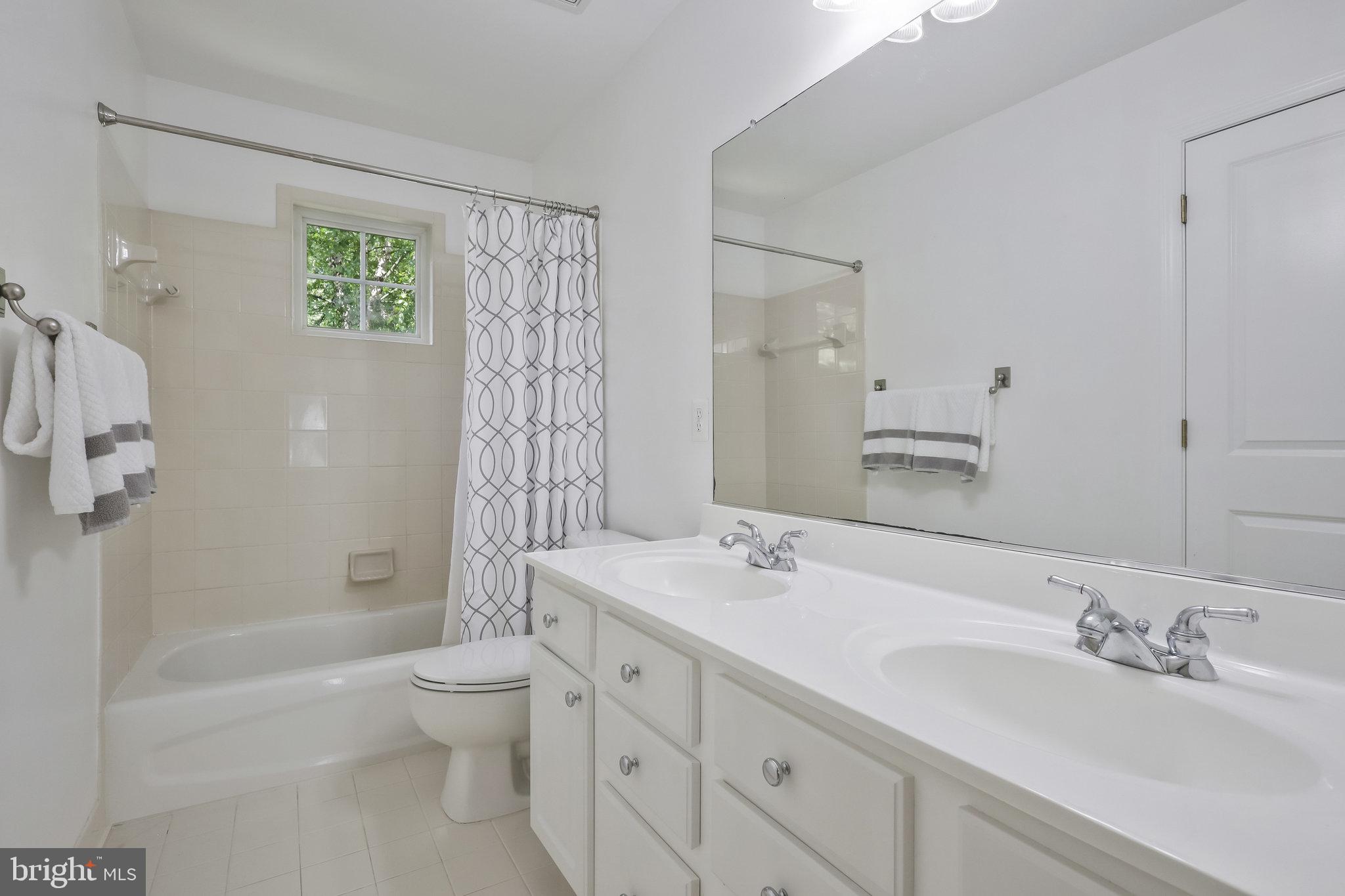 7715 Ridgepark Court Springfield, VA 22153 - Photo 37 of 69 Hallway Bathroom with Dual Sinks