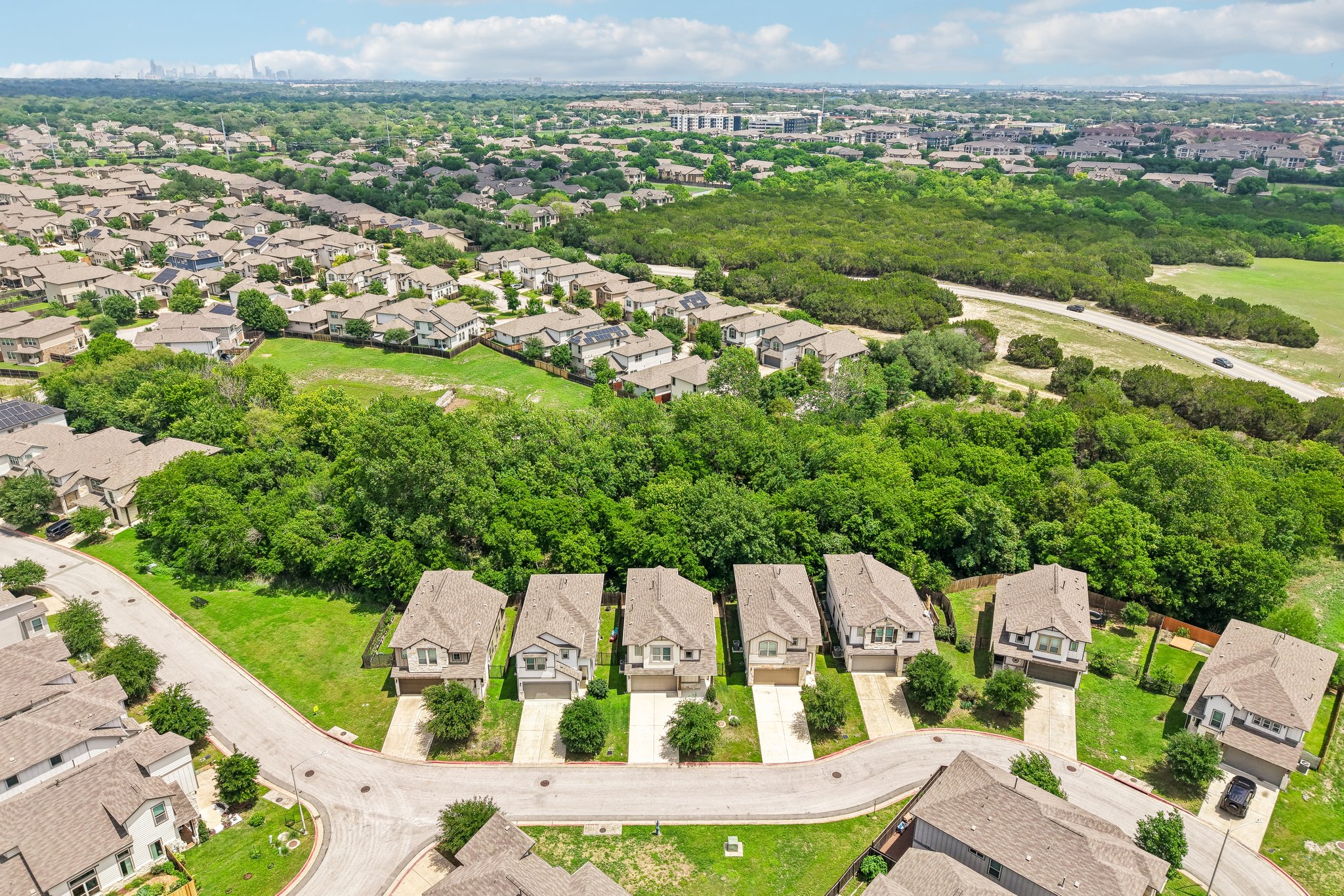 808 Totis Road Austin, TX 78748 - Photo 38 of 40 Residential neighborhood with numerous homes and extensive tree coverage