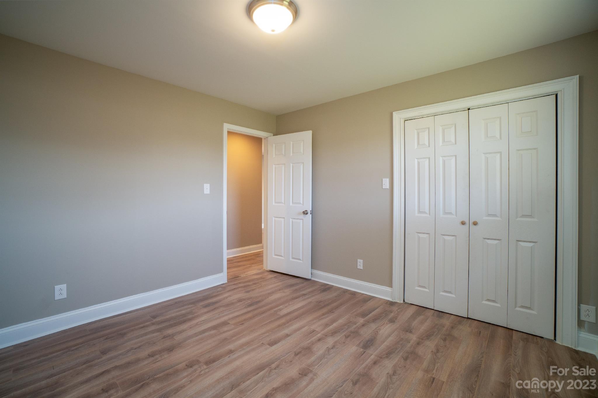 446 Rash Road Olin, NC 28660 - Photo 25 of 35 a view of an empty room with wooden floor