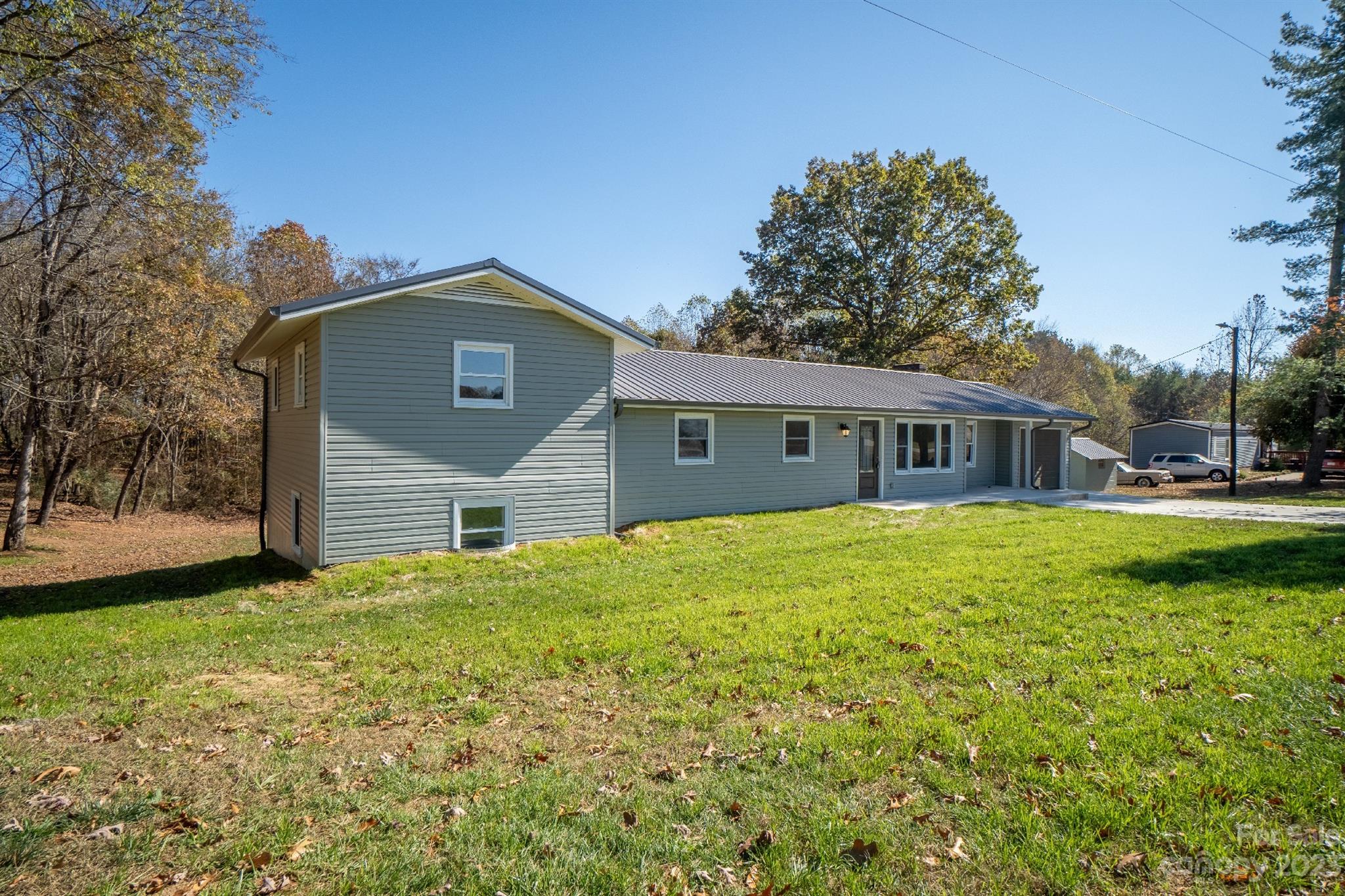 446 Rash Road Olin, NC 28660 - Photo 3 of 35 a front view of a house with a yard