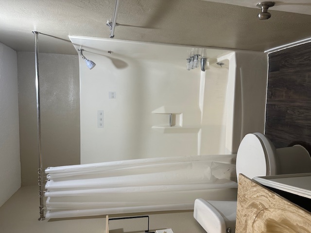 1001 Ridgeline Drive Round Rock, TX 78664 - Photo 8 of 11 Full bath featuring shower / bath combo, dark wood-style floors, and vanity