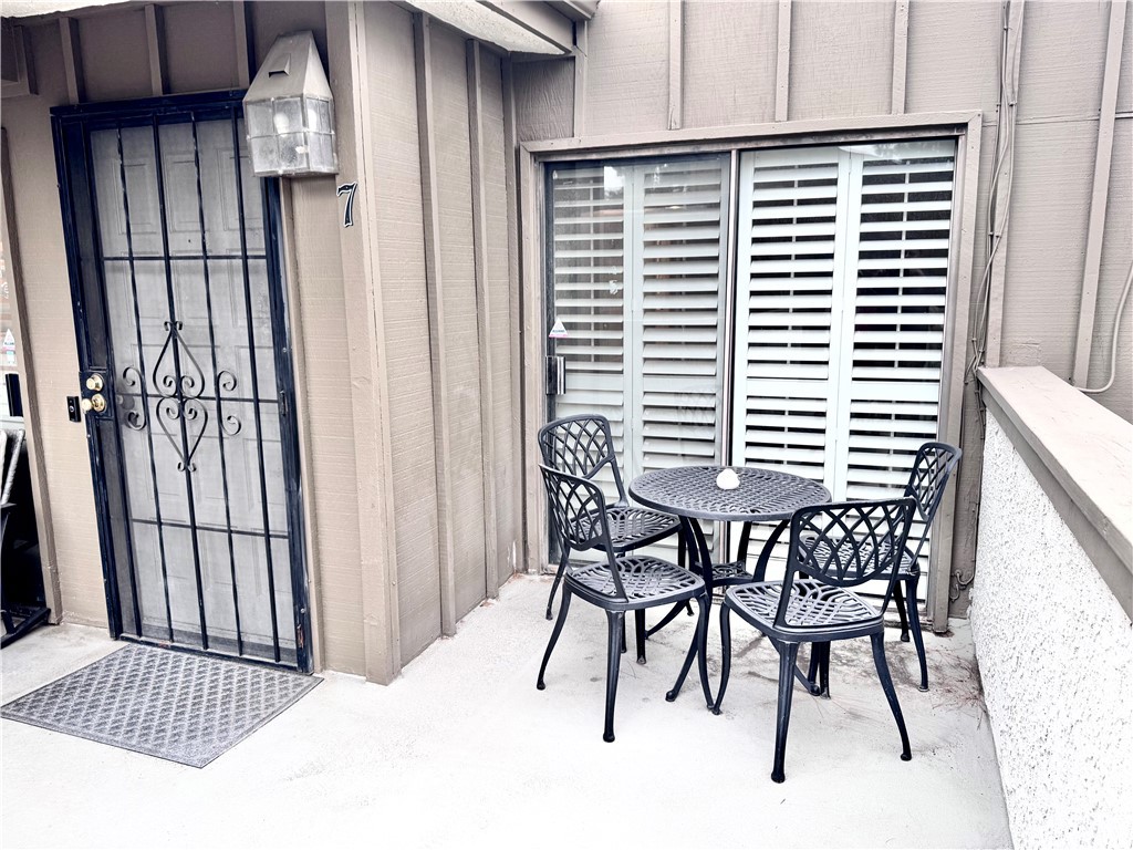 16255 Devonshire Street, Unit 7 Granada Hills, CA 91344 - Photo 13 of 16 a bedroom with a bed and a window