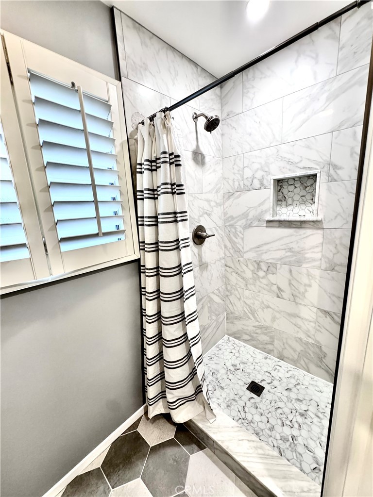 16255 Devonshire Street, Unit 7 Granada Hills, CA 91344 - Photo 9 of 16 a bathroom with a shower