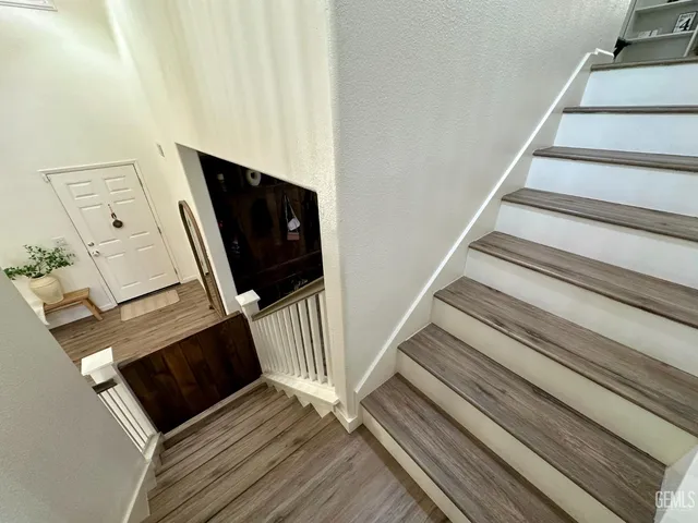 a view of living room kitchen with furniture and wooden floor