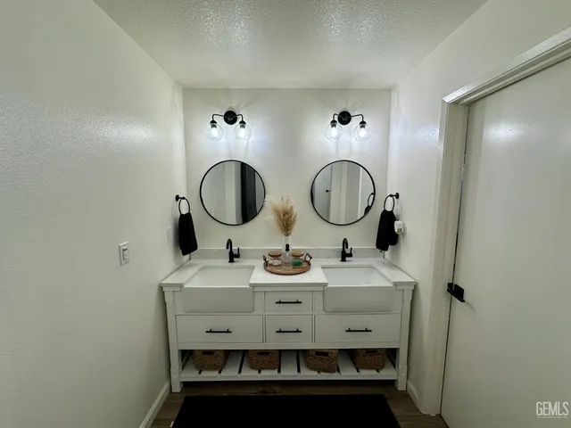 a bedroom with bed and a chandelier