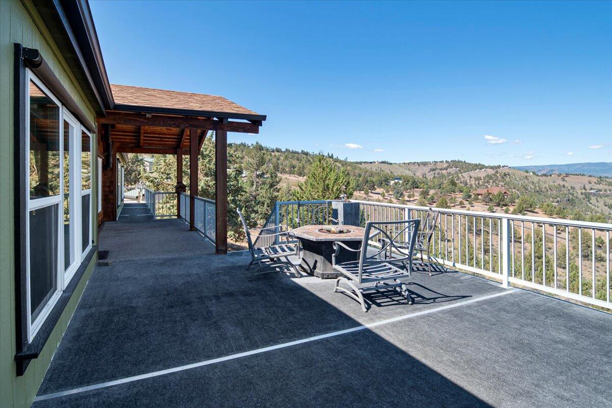 11182 Southwest Dynamite Lane Culver, OR 97734 - Photo 15 of 70 a view of a chairs and table in the balcony