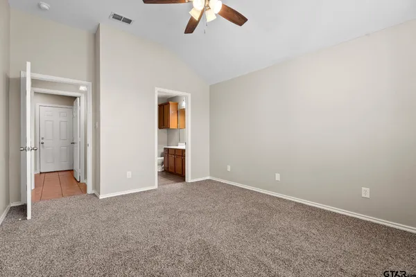 an empty room with closet area
