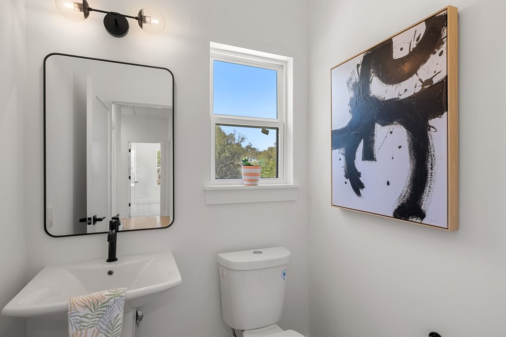 408 Rust Ranch Road Blanco, TX 78606 - Photo 24 of 35 Half bathroom with toilet and a sink