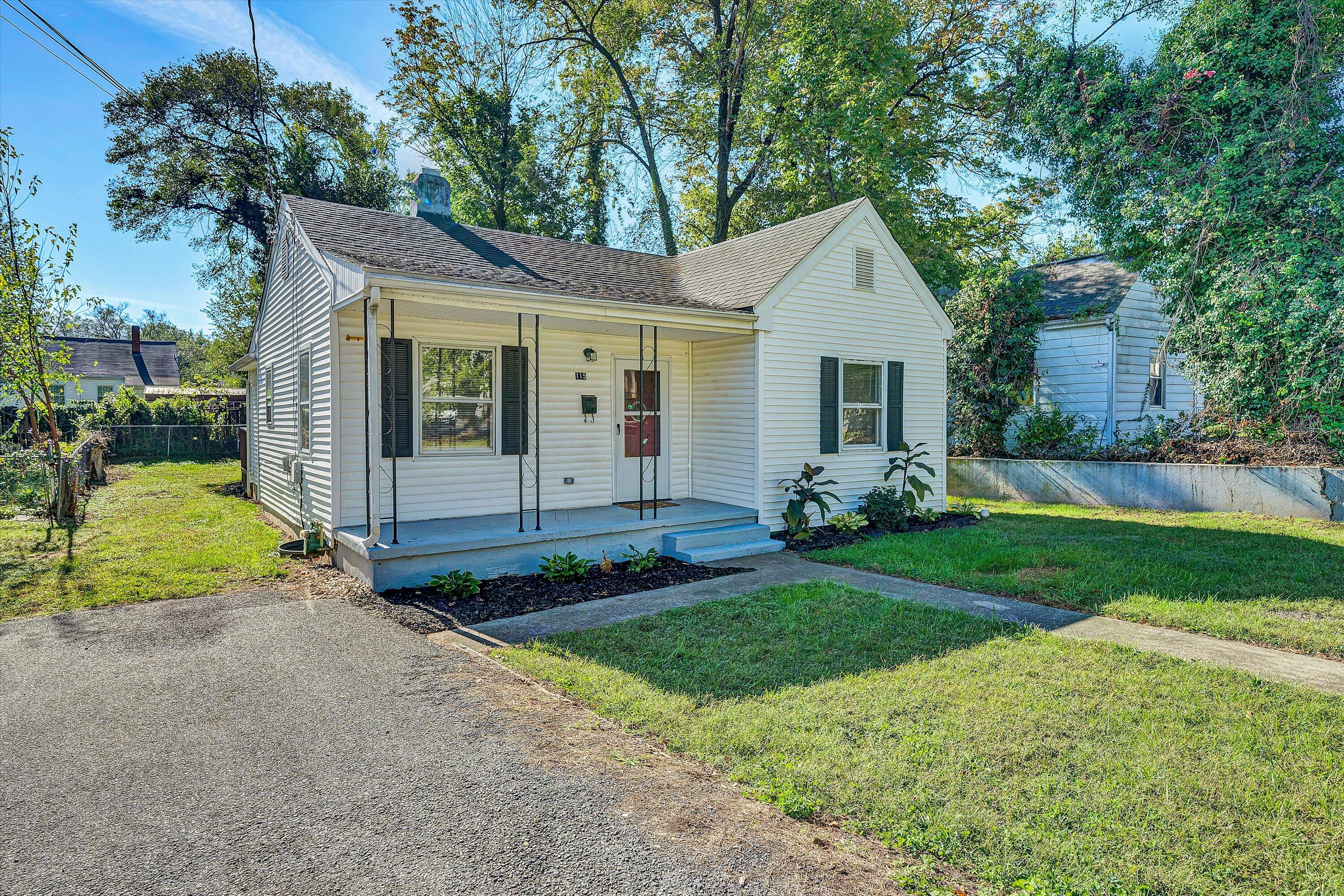 115 Liberty Road Northeast Roanoke, VA 24012 - Photo 2 of 24 a view of a house with a yard and large tree