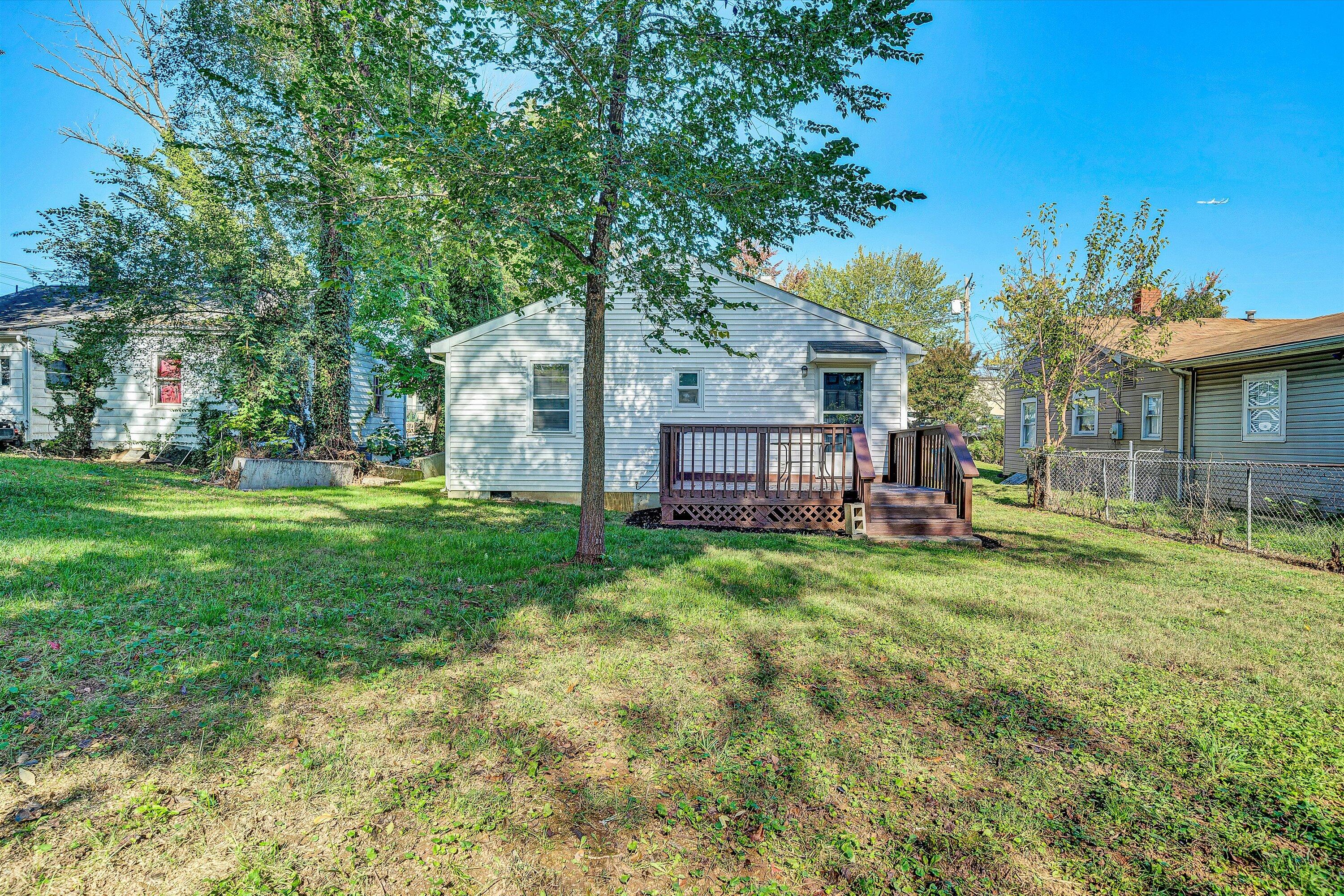115 Liberty Road Northeast Roanoke, VA 24012 - Photo 24 of 24 a view of backyard of house with green space