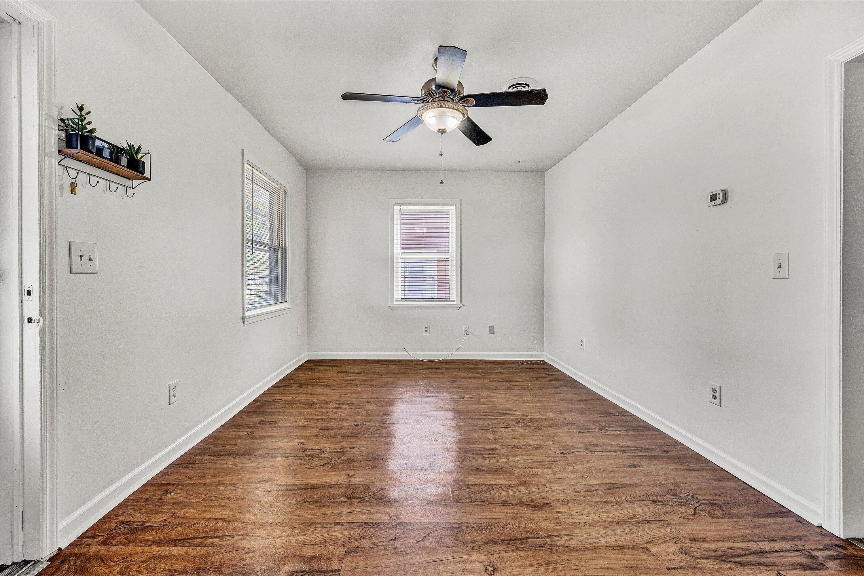 115 Liberty Road Northeast Roanoke, VA 24012 - Photo 5 of 24 wooden floor in an empty room with a window